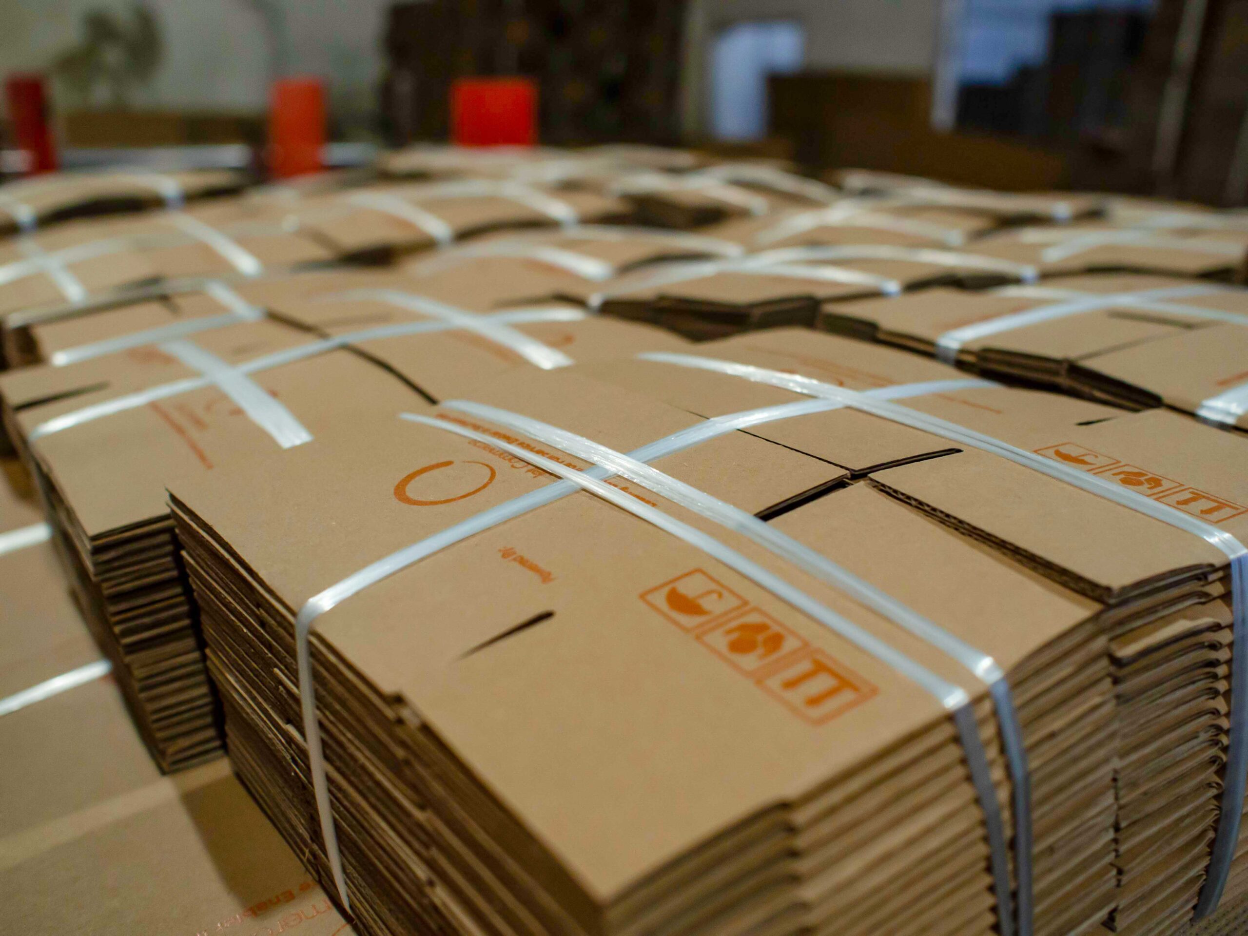 Stacked corrugated cardboard sheets ready for production